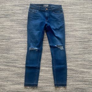 Cropped Medium-Wash Jeans with Rips and Fringe
